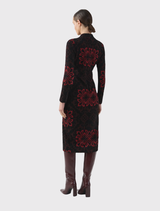 Stretch knit jacquard dress in red and black, featuring a high neckline, long sleeves, and a fitted above-the-knee design.