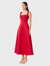 Lucetta's red fit and flare midi dress featuring a square neck, elegantly draped on a mannequin for visual appeal.