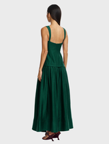 Sculptural deep emerald maxi dress with a lined bodice, designed for comfort and poise at formal events.