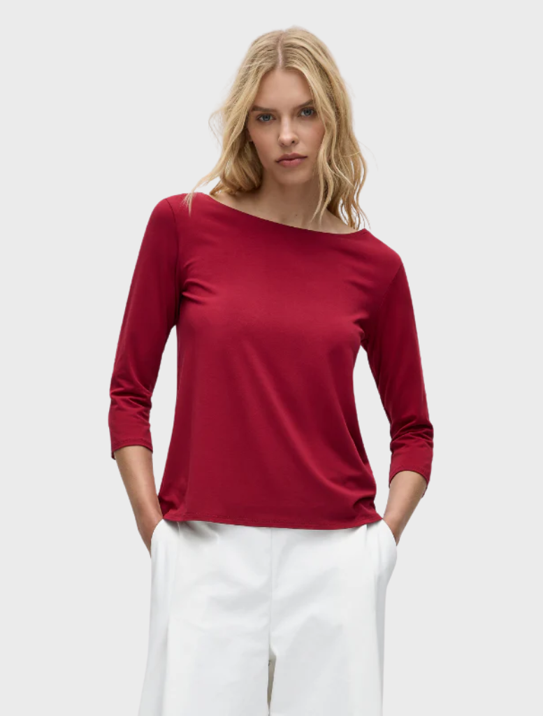 Relaxed boat neck top in a rich berry color, featuring a comfortable fit and casual style for everyday wear.