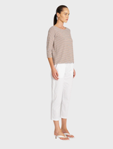 Comfortable boat neck top in saddle and white, offering a relaxed silhouette for everyday wear.