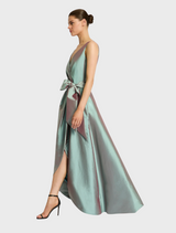 A fashionable dress that includes bows on the front and back, enhancing its unique and playful style.