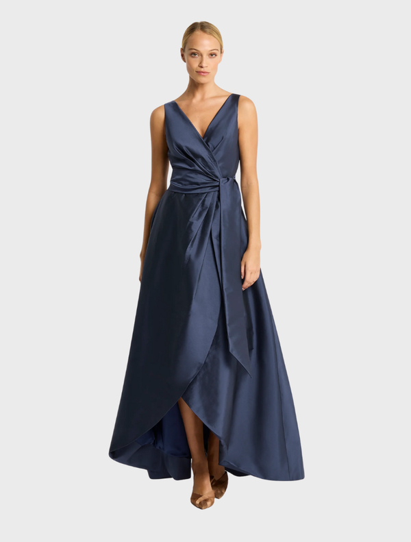 Elegant navy Rene gown featuring a fitted silhouette and flowing skirt, perfect for formal occasions.