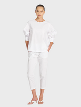 White cotton top with stylish puff sleeves, ideal for casual or dressy occasions.