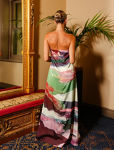 The Lucie Dress features a flowing A-line shape, strapless neckline, and unique resin print, perfect for holiday dressing.