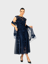Sophisticated navy gown with cap sleeves and a flowing godet design, enhanced by delicate rosette details.