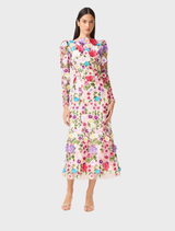 Multi floral rosette long sleeve midi dress hanging on a rack, highlighting its colorful design and flowing fabric.