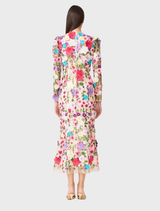 Elegant long sleeve midi dress in a multi floral print, presented on a mannequin with soft lighting.