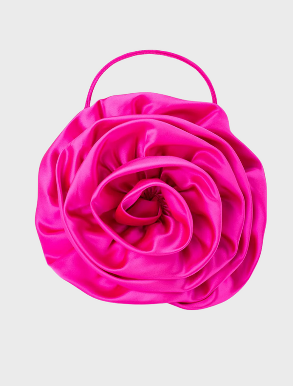A pink satin flower bag with a handle, named Rosita Rosette Frame Bag in fuchsia color.