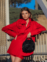 Elegant black Rosita Rosette Frame Bag with a unique rosette detail, perfect for enhancing any outfit.
