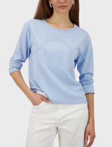 Light sky blue round neck jersey featuring a basic emblem design.