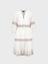 Cream-colored round neck dress showcasing beautiful embroidery patterns across the fabric.