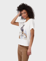  Model wearing a cream round neck T-shirt featuring a cat graphic on the front.