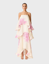 Cream and pink floral tiered gown displayed on a mannequin, showcasing its elegant design and soft color palette.