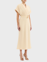 A bright yellow dress adorned with a belt and collar, highlighting a trendy and sophisticated style.