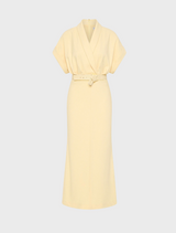 A yellow dress featuring a belt and a collar, showcasing a stylish and elegant design.