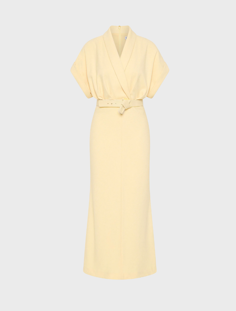 A yellow dress featuring a belt and a collar, showcasing a stylish and elegant design.