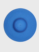 Modern royal blue racewear hat featuring a sculptural shape and fitted headband for comfort and effortless styling.