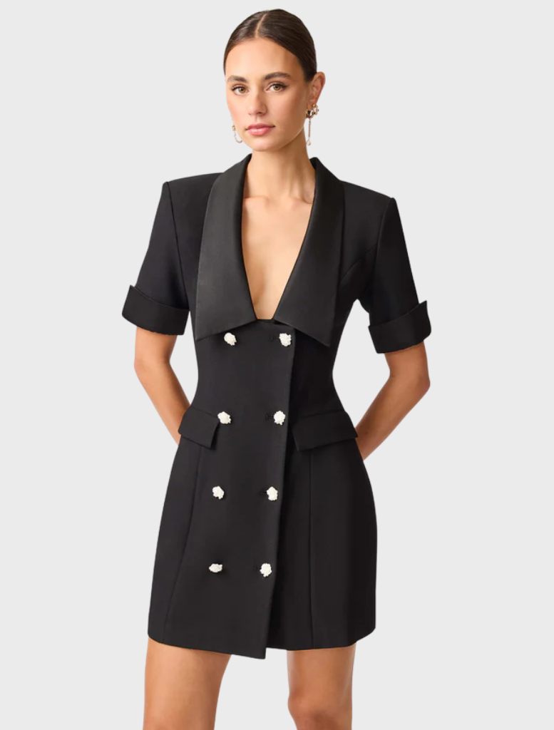 Stylish black blazer dress featuring a wool blend fabric, combining comfort with a chic silhouette.