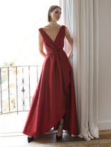 Stunning ruby gown featuring a sleek silhouette and delicate details, ideal for special events or galas.
