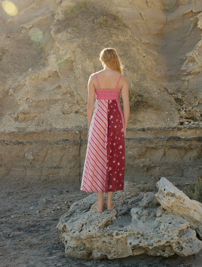 The Rue Dress, adorned in a Redcurrant Multi design, offers a chic look with its vibrant colors and soft fabric.