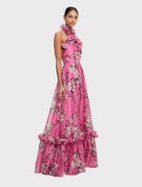 Halterneck maxi dress in pink magnolia print, designed with ruffles for a stylish and feminine look.