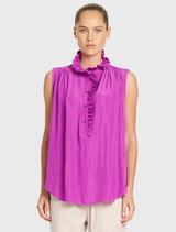 This sleeveless Rufflet Tank by Dahlia features a ruffle collar, gathered shoulders, and a relaxed fit in a lustrous fabric.