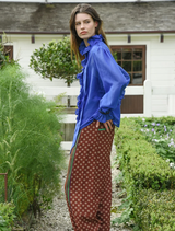 Russet Multi Follow The Track Pant showcases a stylish, colorful pattern perfect for sports and everyday comfort.