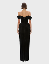 Black Ryn gown laid flat, emphasizing its intricate design and smooth texture.