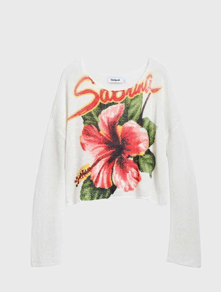 white sweater that has a charming floral print.