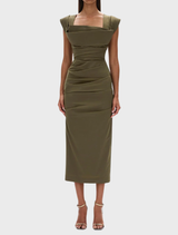 Olive green Salma dress displayed on a mannequin, showcasing its elegant design and flowing fabric.