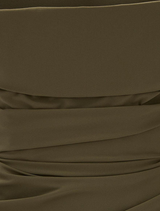 Full view of an olive Salma dress, illustrating its graceful lines and contemporary design.