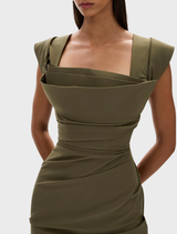 A stylish olive Salma dress hanging on a rack, featuring a flattering silhouette and soft texture.