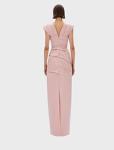 The Salma gown in rosewater showcases a graceful design with a light, airy fabric perfect for formal occasions.

