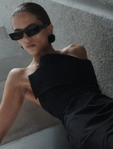 Elegant black strapless gown featuring a fitted bodice and flowing skirt, perfect for formal occasions.