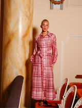  Pink plaid maxi shirtdress with a classic collar, balloon sleeves, and a matching belt for adjustable waist fit.
