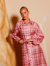 Breezy pink plaid maxi dress featuring a button-front, classic collar, and elasticated balloon sleeves for a stylish look.