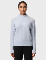 Blue Frost Savanna Alpaca Blend Sweater laid flat, illustrating its luxurious feel and contemporary style.