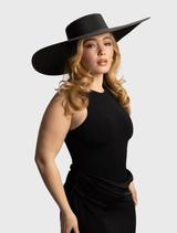 Black Savannah boater hat with a classic shape and wide brim, perfect for special occasions. Comfortable, one-size design.