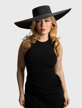 Elegant black boater hat with a structured crown and wide brim, suitable for racewear and weddings. One size available.