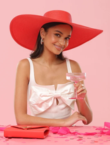 Stylish red boater hat with a wide brim and structured crown, designed for racewear and special occasions, one size fits all.