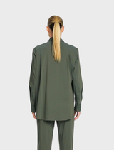 Lightweight Microprene Saville Shirt in Bayleaf, showcasing a long line silhouette, crisp collar, and functional pocket.
