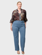 Elegant high-waisted pants in sky-blue faux suede, featuring a unique waistband and a relaxed fit for all-day comfort.