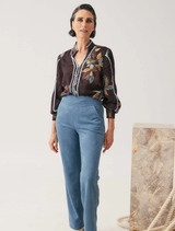 Sky-blue faux suede high-waisted pants with a wave-shaped waistband, offering comfort and a flattering fit for various occasions.
