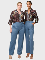High-waisted sky-blue pants in faux suede, featuring a structured waistband and a slim, relaxed leg for versatile styling.