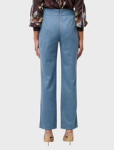 High-waisted sky-blue faux suede pants with a wave-shaped waistband, offering comfort and a flattering fit for various occasions.