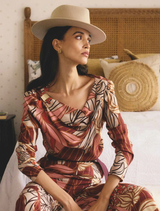 A stylish top featuring a serene gold detail with a botanical print on cupro viscose stretch fabric.