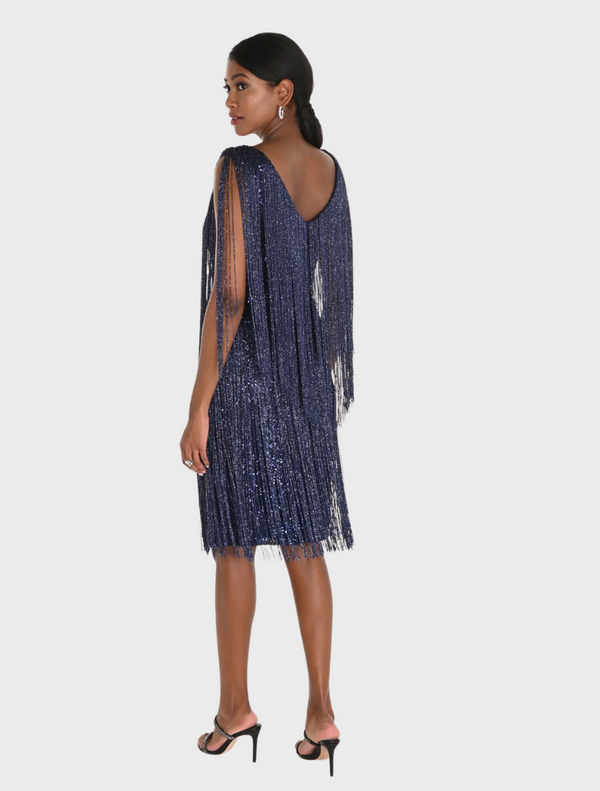 Black sequinned fringe adorns a 1920s flapper dress, reflecting the vibrant and bold fashion of the Roaring Twenties.