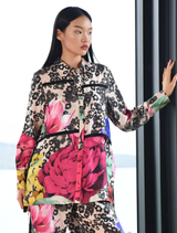 Sheer As Day shirt in scattered daisies viscose satin, featuring ties, button placket, and deep cuffs for a romantic look.