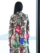 Elegant Sheer As Day shirt in floral viscose satin, showcasing ties, a button placket, and deep cuffs for a romantic style.